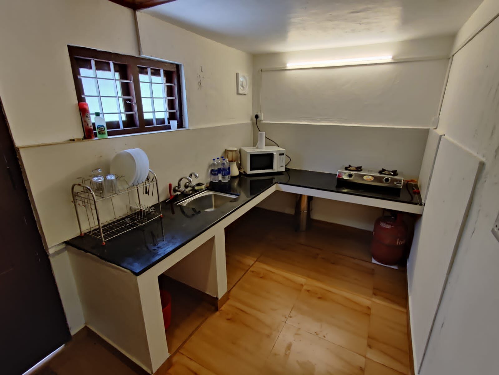 Kitchen with sink, counter and gas stove